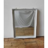 A CONTEMPORARY CREAM FRAMED OVERMANTEL AND WALL MIRROR, both with bevelled edges, the mirrror in