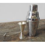 A PERUVIAN SILVER JIGGER WITH HORSE HEAD DECORATION AND AN E.P.N.S SILVER PLATED COCKTAIL SHAKER,