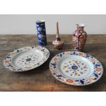 A PAIR OF IMARI PLATES, BOTTLE VASE AND TWO OTHER VASES, the plates measuring 21 cm dia