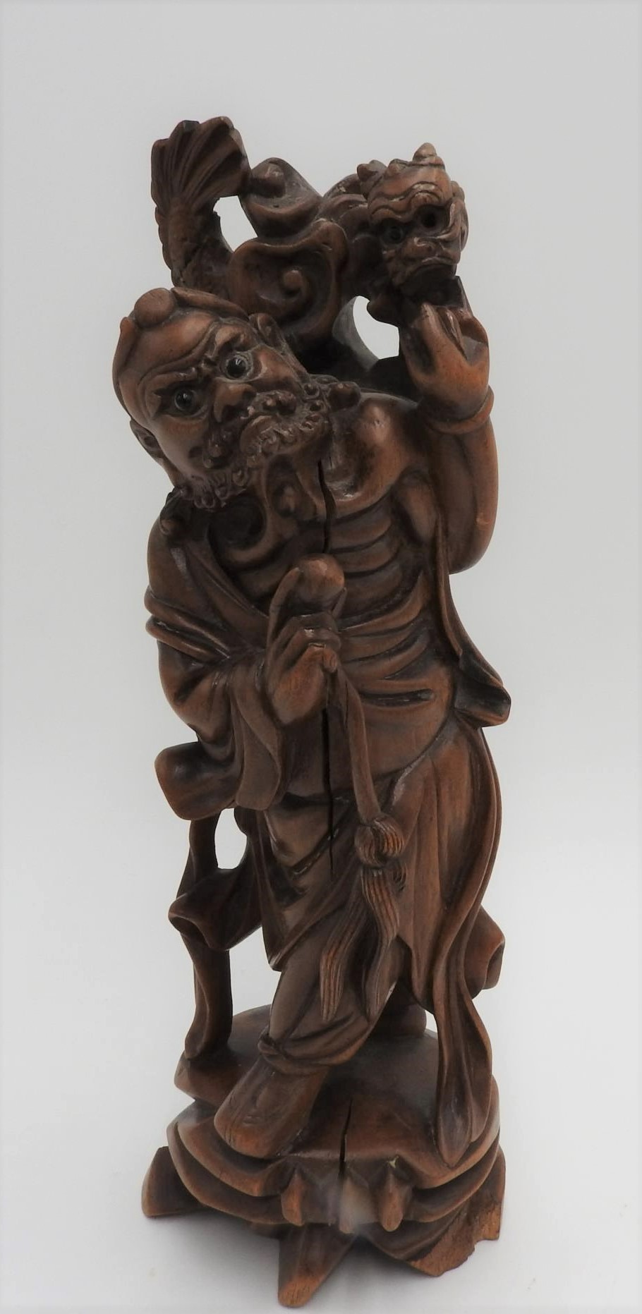 CARVED HARDWOOD OKIMONO OF AN ONI MEIJI PERIOD (1868-1912) 23cm high