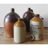 FOUR SALT GLAZED BREWERY JARS, one with an impressed mark ' T. Garratt, Wine & Spirit Merchant,