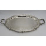 A LARGE PERUVIAN SILVER OVAL TWO HANDLED TRAY BY CAMUSSO, with lotus flower detailing to the rim,