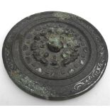 A CHINESE BRONZE MIRROR SUI DYNASTY OR LATER 15cm wide  PROVENANCE: Private collection, acquired