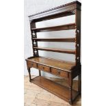 A 20TH CENTURY OAK DRESSER WITH PLATE RACK, the dresser base with three drawers and open shelf