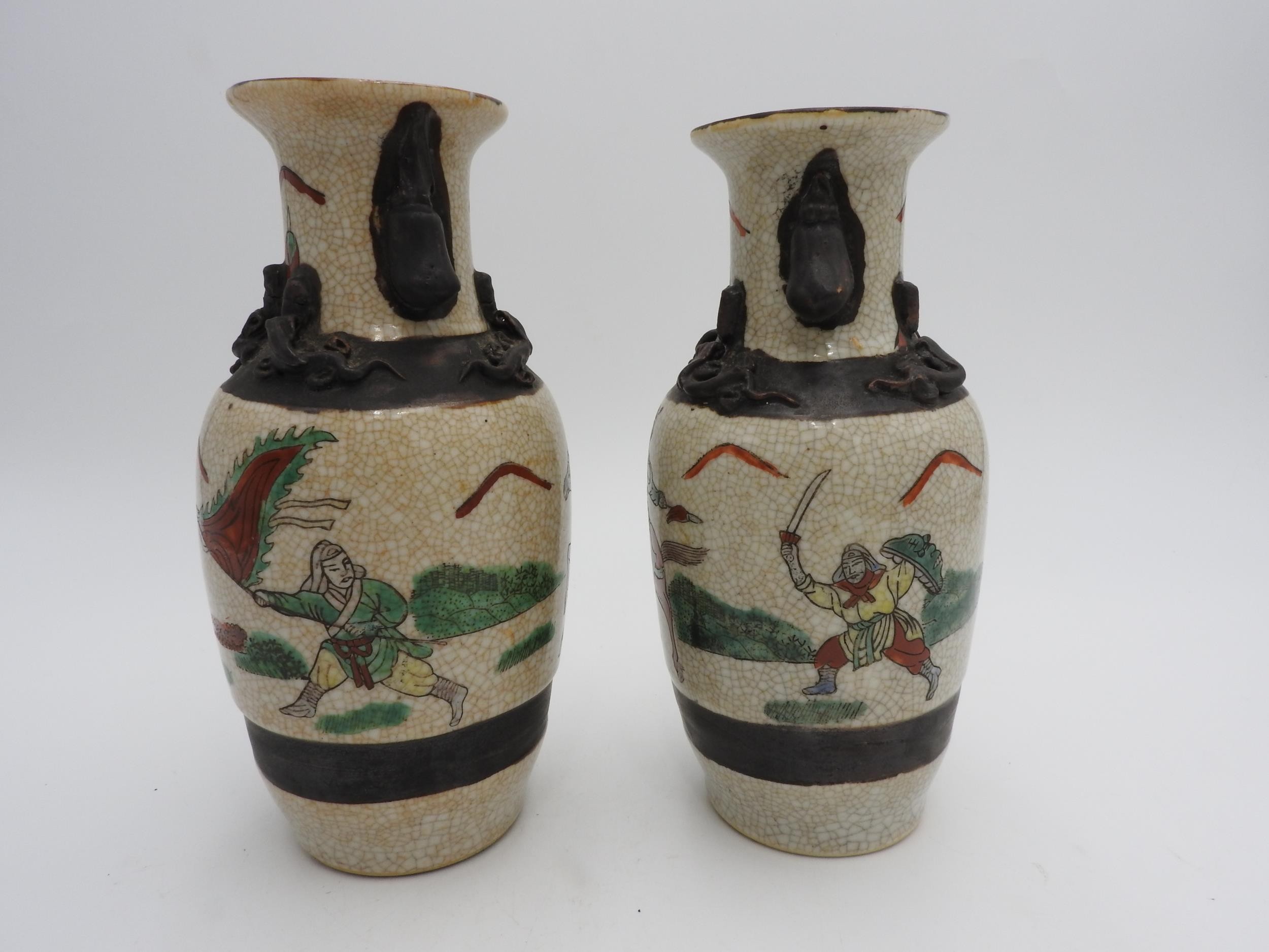 SMALL PAIR CANTON VASES LATE QING DYNASTY painted with warriors on horseback 20cm high - Image 2 of 3