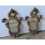 A PAIR OF GILT FRAMED 19TH CENTURY ROCOCO WALL MIRRORS, 52 X 32 cm