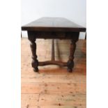 A 19TH CENTURY FRENCH OAK FARMHOUSE TABLE ON TURNED LEGS