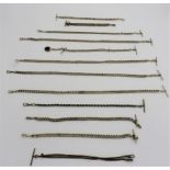 A COLLECTION OF TWELVE WATCH CHAINS, one with a hardstone fob