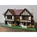 A VINTAGE 1930'S PAINTED DOLLS HOUSE, 64 x 120 x 44 cm