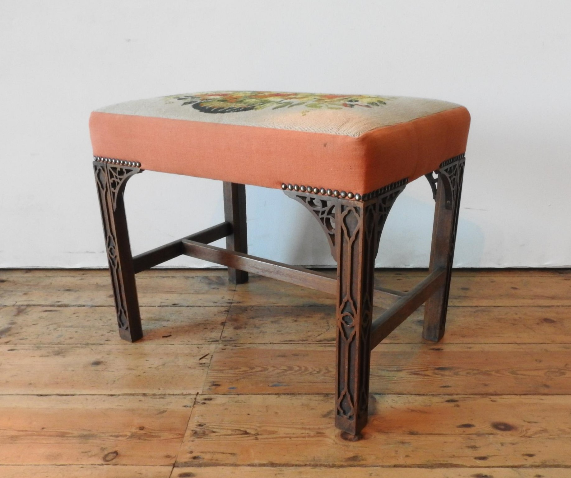 A 19TH CENTURY MAHOGANY FRAMED TAPESTRY TOP STOOL, the tapestry depiciting a floral arrangement, the