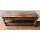 A RUSTIC PINE FARMHOUSE PLANK TOP DRESSER BASE, with three drawers and shelf below, 73 x 69 x 190 cm
