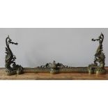 A 19TH CENTURY ORNATE BRASS ADJUSTABLE FIRE CURB, with pierced rail and ornate acanthus