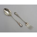 A PERUVIAN SILVER SERVING SPOON AND FORK by Camusso, stamped Sterling 925, with lotus flower