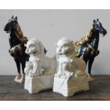 A PAIR OF BLANC DE CHINE LION FIGURES AND TWO TANG-STYLE HORSE FIGURES