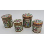 FOUR 19TH CENTURY FAMILLE ROSE DECORATED JARS WITH LIDS, the largest measuring 9.5 cm high