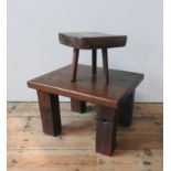 A HEAVY RUSTIC OAK COFFEE TABLE AND RUSTIC STOOL