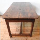A FRENCH 19TH CENTURY RUSTIC FRUITWOOD FARMHOUSE TABLE WITH DRAWER, the square legs supported by a