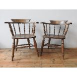 A 19TH CENTURY ELM SEAT SMOKER'S BOW CHAIR AND ONE OTHER, with twin stretcher bar supports, turned
