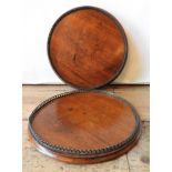 A PAIR OF 19TH CENTURY MAHOGANY CIRCULAR TRAYS, with gallery edge, 26 cm dia