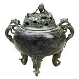 BRONZE TRIPOD 'DRAGON' CENSER AND COVER QING DYNASTY the domed cover surmounted by a dragon emerging