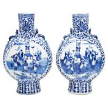 PAIR OF BLUE AND WHITE MOONFLASKS QING DYNASTY, 19TH CENTURY the flattened ovoid sides painted in