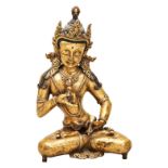 GILT BRONZE FIGURE OF SEATED GREEN TARA TIBET, 19TH CENTURY the seated deity loosely draped and