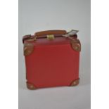 A small Red Globe-trotter suitcase with leather handle 23 x 21 x 12cm