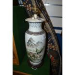 Chinese vase decorated with figuires in a mountainous scene converted to a lamp, 43cm high overall