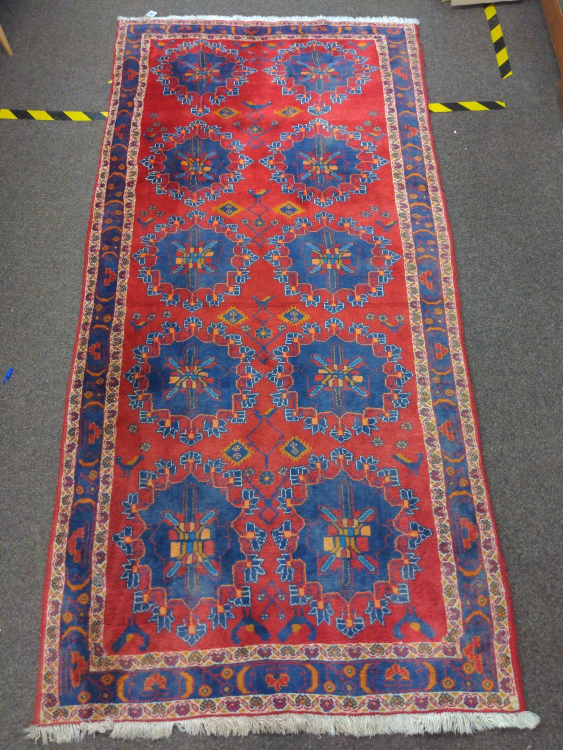 Ushak style star pattern rug. W120cm L261cm 