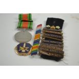 George VI Defence Medal, ribbon bar, & Special Service badges dating 1905 to 1910 & another badge