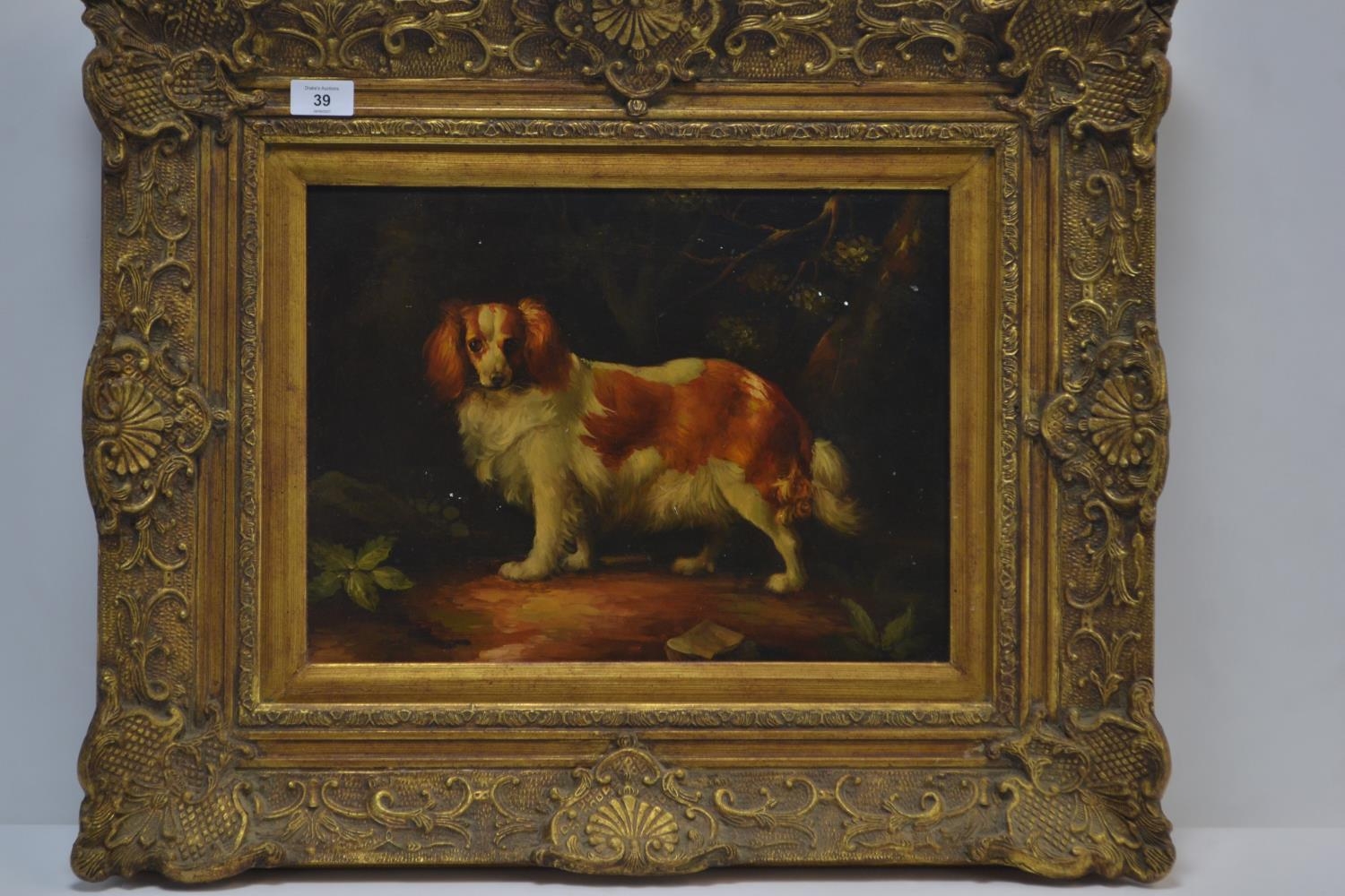 C19 oil on board of a spaniel standing, in an ornate gilt frame. 65cm x 55xm inclusive of frame 