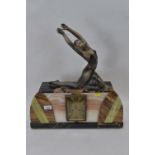 A 1930's Art Deco French marble mantle clock garniture with spelter lady atop. Has replacement quart
