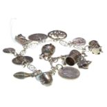 Silver & unmarked charm bracelet, circumference 185mm, gross weight 30.33 grams