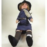 Fabric doll in girl guides uniform.