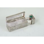Continental 800 grade silver lipstick compact, with green cabouchon clasp, 5.5cm length, 26.25 grams