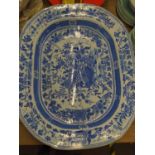 Large Staffordshire blue and white transfer printed 'tree & well' meat platter, circa 1820-30, in a