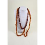 Two amber coloured bead necklaces