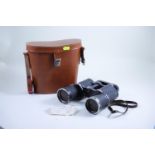 Binoculars in leather case 7x50 magnification., Spare yellow and green lenses.