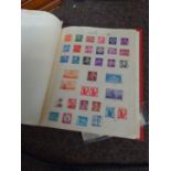 Red album of USA stamps, mint & used