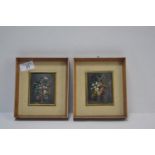 Pair of framed floral paintings behind curved glass. Frames measure 14cm x 16cm. Paintings 7cm x 9cm