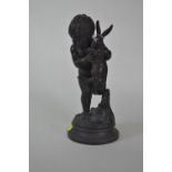 Bronze figure of putto and hare signed Dumaige to base. H27cm.