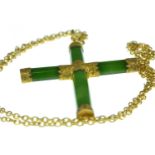 Yellow metal & green hardstone cross pendant, tests positive for 14ct gold, suspended from a gilt me