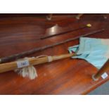 Cream and aqua parasol, cane swagger stick and back scratcher.