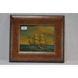 Oil painting of ship in walnut frame.
