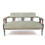 Mahogany carved horsehair sofa on casters.&nbsp; W135cm D59cm H73cm.