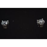Pair of 18ct gold &amp; 0.2ct diamond stud earrings, gross weight 1.1g