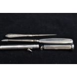 Sampson Mordant silver pencil, Birmingham silver plus cigar pricker and 'drizzler', gross weight 64.