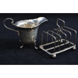 Silver cream jug, maker A Bros LTD, Birmingham 1922, together with a silver toast rack, maker HA, Sh