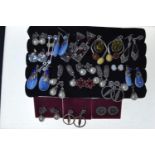 Twenty pairs of new earrings marked 925, variously set