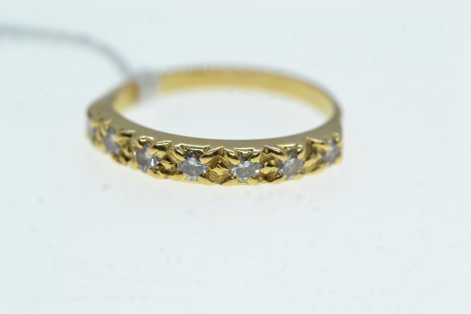 Yellow metal & seven stone diamond half hoop ring, tests positive for 18ct gold, size Q, 3 grams 